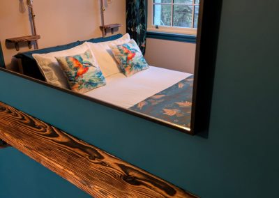 Bed room reflected in mirror