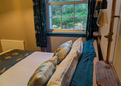 Bed, Lights and window in room