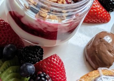 Breakfast -Yogurt with homemade compote layers, fresh fruit and freshly baked pastries