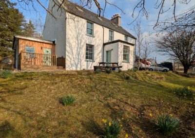 View of the house from the front garden in early spring