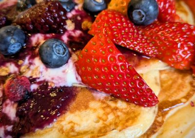 Breakfast - Homemade scotch pancake stack with fresh berries, yogurt and homemade berry compote